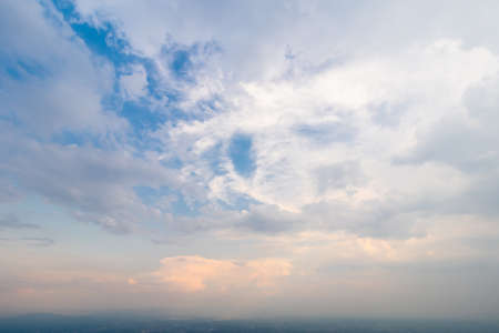 blue bright and orange yellow dramatic sunset sky in countryside texture background.の写真素材