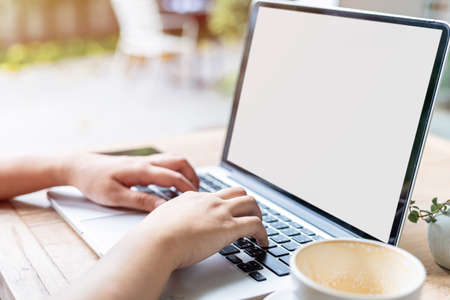 Close-up of freelance people business female casual working with laptop computer with coffee cup ...