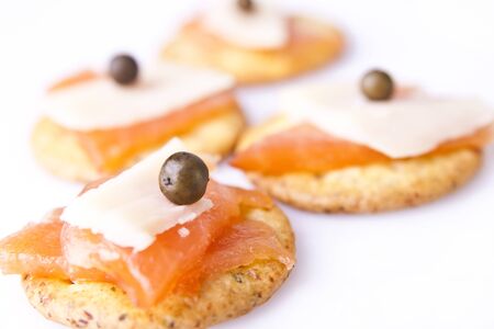 A close-up of salmon and cheese canapes. の写真素材