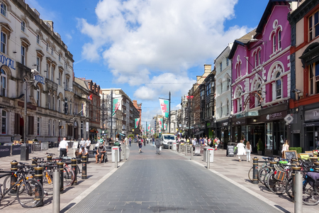 Cardiff, United Kingdom, Wales - August 26, 2016: Tourists and locals going shopping in St Mary Street on Friday morning. The road is the home of a number of shops, bars, night clubs and restaurants as well as branches of many major banks.のeditorial素材