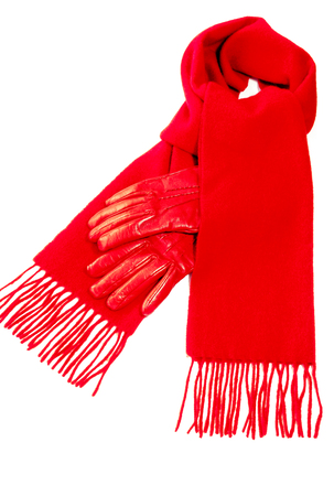 Red scarf out of pure cashmere wool  and warm  red leather gloves for winter isolated on white background.の写真素材
