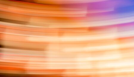 Abstract Motion Blur Background in bright orange, brown, pink and purple colors.の写真素材