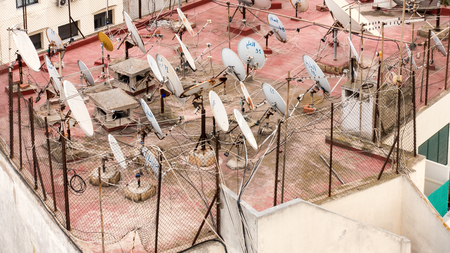 Casablanca, Morocco - May 05, 2017: Many satellite dishes on a rooftop in Casablanca, Morocco, Africa.のeditorial素材
