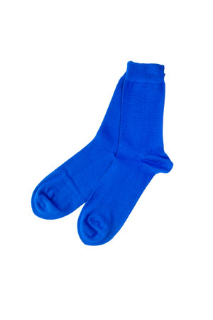 A pair of bamboo socks in modern vibrant blue color on white background. Top view.の写真素材