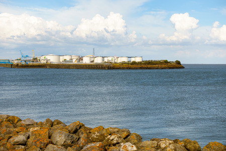 Cardiff, United Kingdom - August 09, 2018: Oil storage tanks at the Queen Alexandra Dock in Cardiff, Cardiff Bay.のeditorial素材