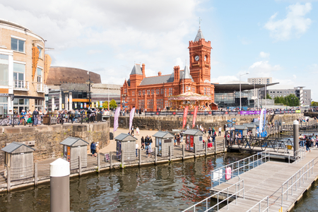 Cardiff, United Kingdom - August 26, 2018: People are enjoying a sunny bank holiday at the harbour festival while watching the Extreme Sailing Series Race.のeditorial素材