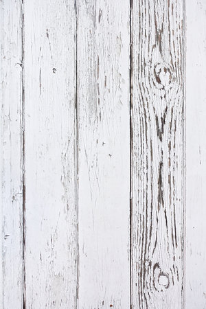 Weathered distressed wood plank background with old white paint.の写真素材