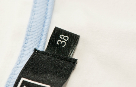 Clothing label with the size 38or Extra Large  Macro photography with extreme detail and shallow depth of field の写真素材