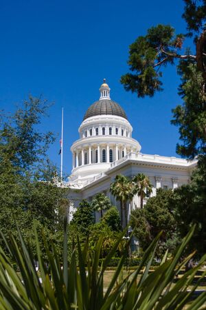 capitol building with flags in sacramentoの写真素材