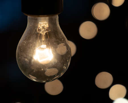 Decorative light bulbs on dark background blurredの写真素材