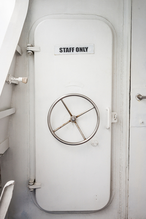 The staff room door on the boat.の写真素材