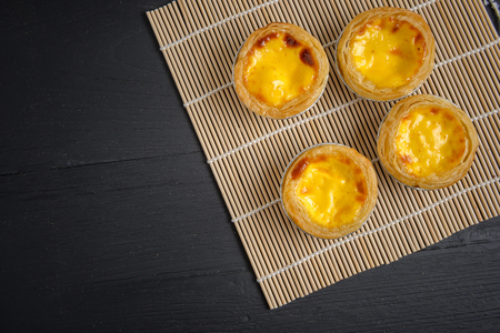 egg tart on black wood