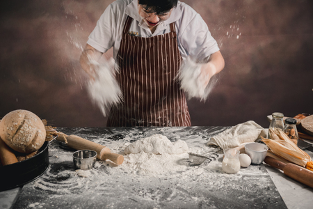 Crazy chef in the kitchen
with bread dough.の写真素材