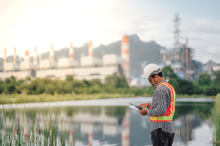 Asian male power plant engineer is working