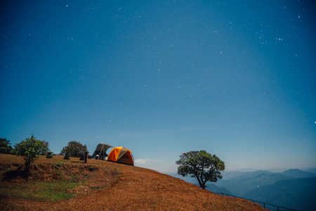 Camping area at the top of the mountain at night. Location: Pui Kho mountain in Northern Thailandの写真素材