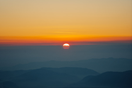 Sunrise on the mountain in Thailand in the winter of Februaryの写真素材