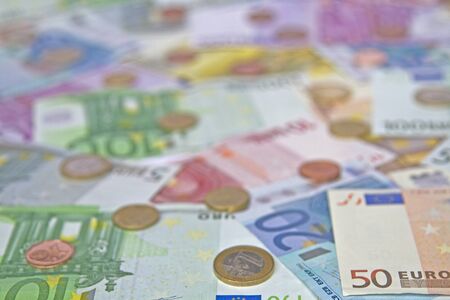 Background image - lots of different euro notes and different, coinsの写真素材
