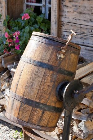 Butter-making - in front of  a Tyrolean mountain hutの写真素材