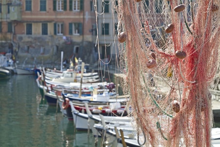 Picturesque fishing nets hung out to dry in the Ligurian port town of Camogliの写真素材