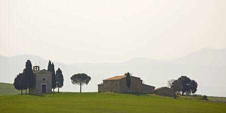 farm with chapel near  Pienzaの写真素材