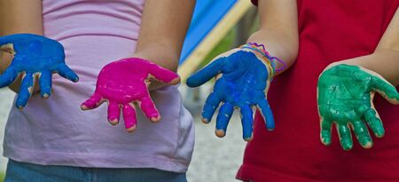 Brightly painted handsの写真素材