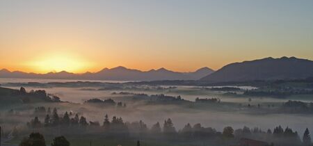 fog banks in the bavarian foothillsの写真素材
