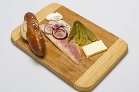 smoked trout on wooden plateの写真素材