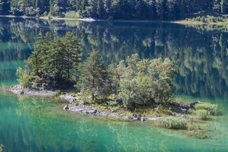 Idyllic small island in the lake Eibseeの写真素材