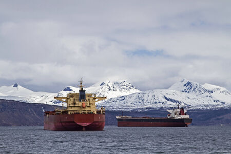 The cargo ship waiting in front of the port of Narvik on their chargeの写真素材