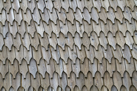 Protected with wooden shingles - wall of a Norwegian building
