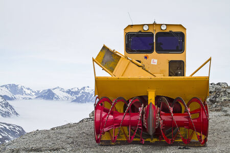Snowblower on a Norwegian mountain pass waiting for its useの写真素材