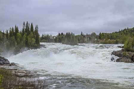 Laksfossen - powerful waterfall south of Mosjen Laksfossen - powerful waterfall south of Mosjen