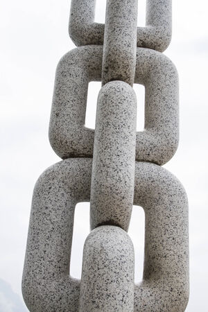 Detail of a monumental stone chainの写真素材