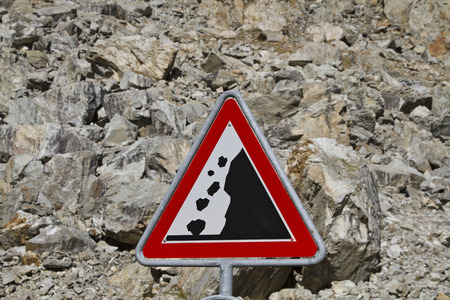 Landslide with standing in front warning boardの写真素材