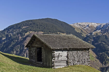 Mountain landscape with hay hut in the Val Medel in Switzerlandのeditorial素材