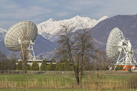 Parabolic antennas in otherwise deserted nature reserve Pian di Spagna north of Lake Comoの写真素材