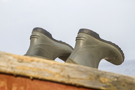 Port Detail Rubber boots aboard a small fishing boatの写真素材