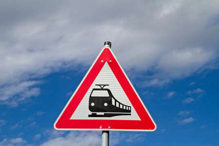 Sign in front of a railroad crossingの写真素材