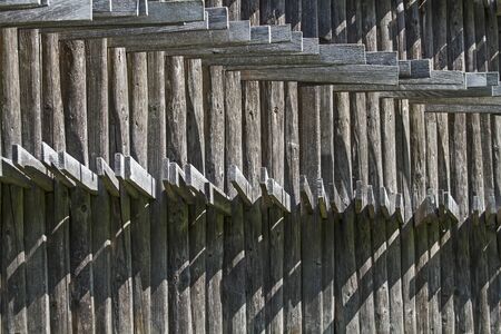 Background - many hay tools  hung on a cabin wallの写真素材