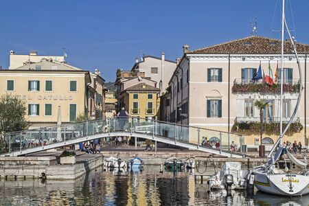 Fishing harbor with beach promenade in Bardolino on Lake Gardaのeditorial素材
