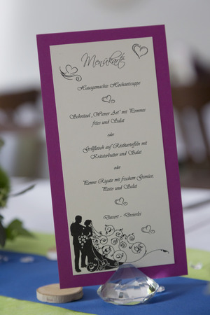 The menu at a wedding party, which was stylishly arranged on the tableの写真素材