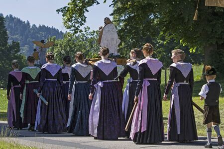Women go in traditional costume at a procession in Upper Bavaria part