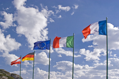 The flags of various European countries flutter on the pass