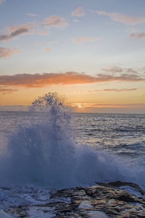 The sun makes a short statement after a bad weather day on the Atlantic coastの写真素材