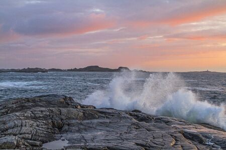 The sun makes a short statement after a bad weather day on the Atlantic coastの写真素材