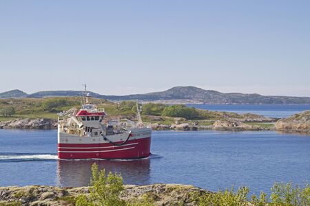Many ships use the waterway of the Naeroysundet, which leads from Rorvik into the free Atlanticの写真素材