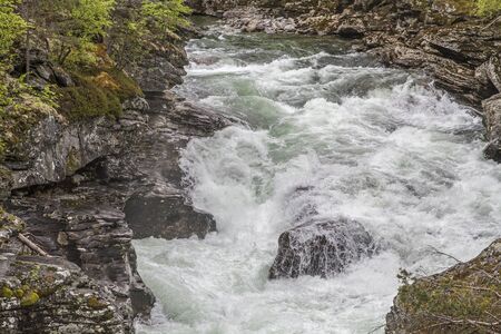The Rauma is a wild water river in the Norwegian provinces of MÃ¸re og Romsdal and Oppland and flows into the Romsdalsfjordenの写真素材