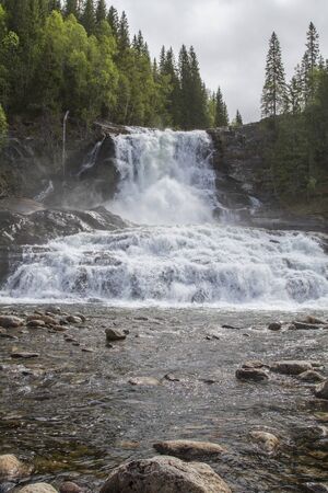 Mighty waterfall of the Kongsmoelva river in the Norwegian province of Nordtrondelagの写真素材