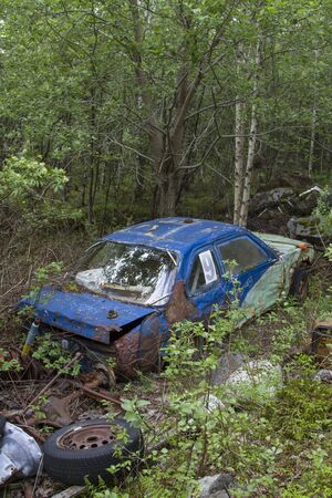 One problem that you come across again and again in the beautiful landscape of Norway is the wild disposal of bulky waste and scrap vehiclesの写真素材