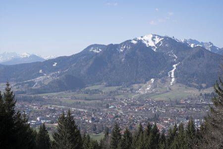 On the hike to the Denkalm you can enjoy the view of Isarwinkel and the village of Lenggriesの写真素材